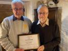 Ernie Gunner receiving recognition for 47 years of Membership in October 2023 from Club President Ian Lampert